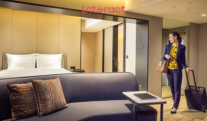 Interact Hospitality mood-enhancing lighting scenes in hotel guest room